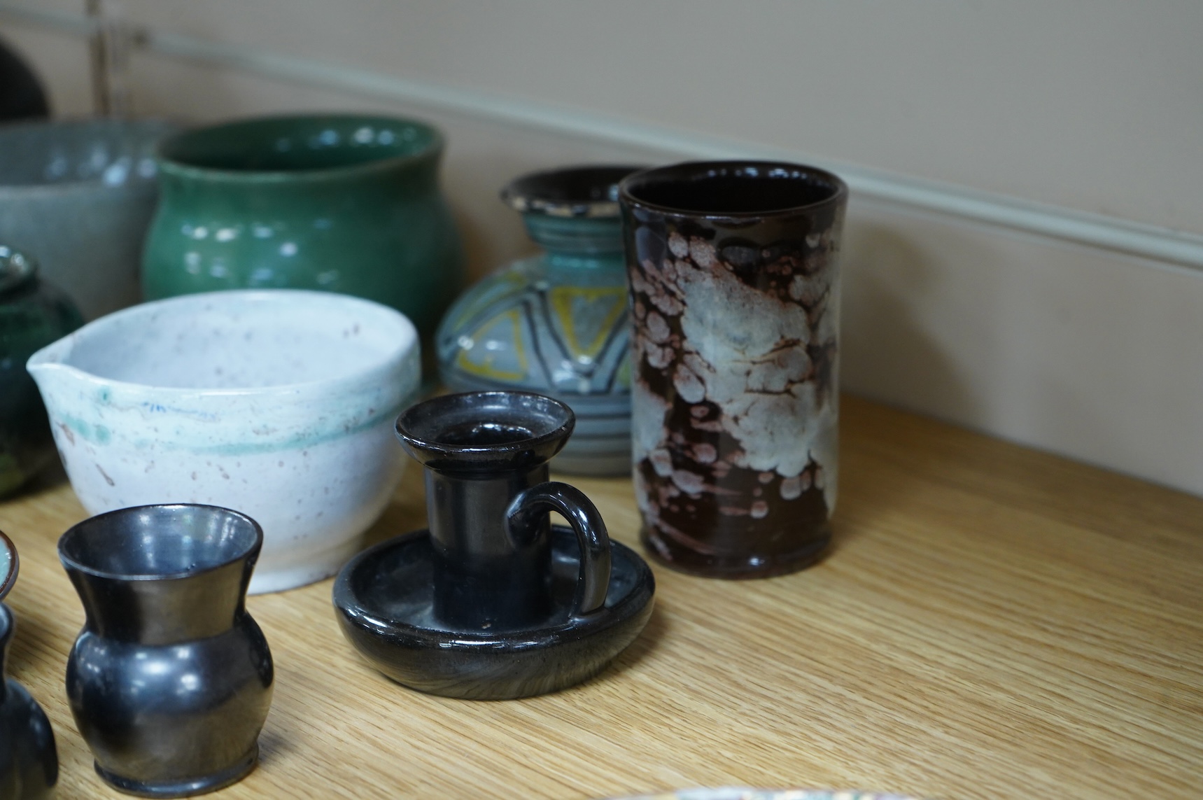 A collection of studio pottery to include a small Danish squat vase, a Brannam, Devon vase and three small Dickerware pieces, largest 13cm high